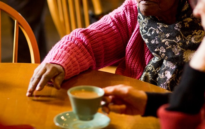Older people share stories at a Reminiscence cafe session