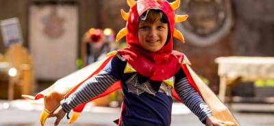 Boy in dragon costume outside Bruce Castle Museum
