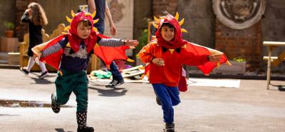 Boys in dragon costumes outside Bruce Castle Museum