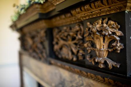 Close of the carving on the fireplace in the Coleraine Room.