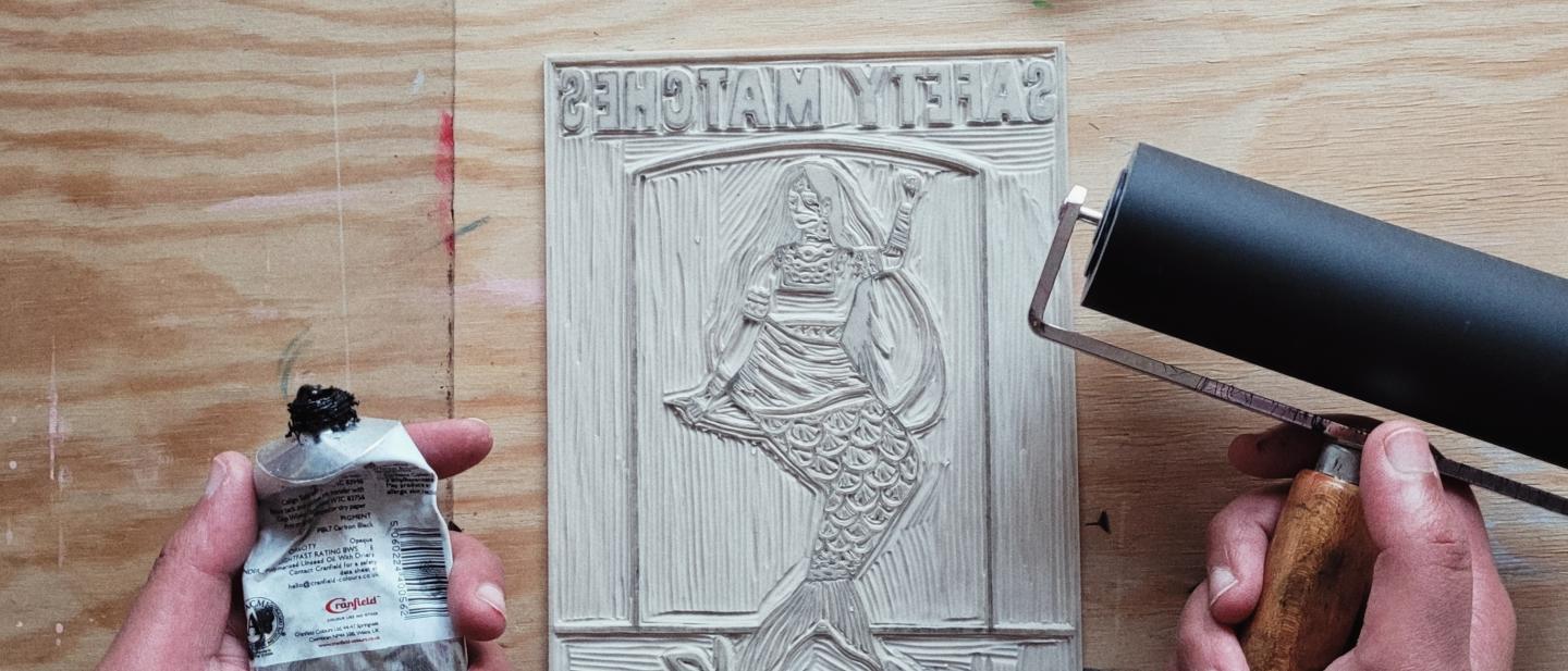 Lino print with artists hands