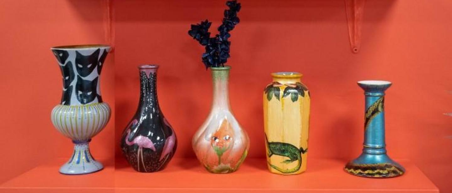 colourful ceramic vases on an orange background