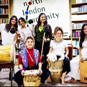 6 women performing Afro-latin music 