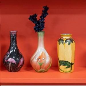 colourful ceramic vases on an orange background