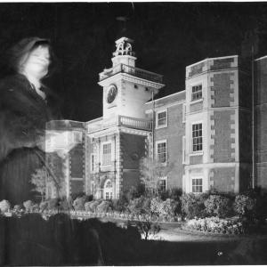 Edited image of a manor house with a ghostly figure in the foreground