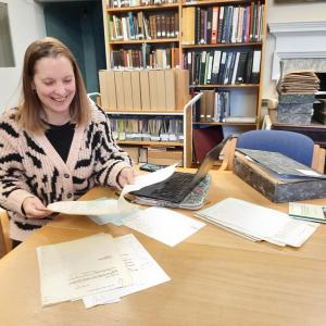 person in archive search room